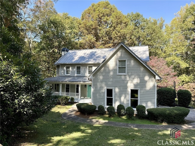 view of front of home featuring a porch and a front lawn