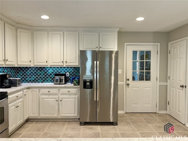 kitchen featuring light stone counters, white cabinetry, stainless steel refrigerator with ice dispenser, and backsplash