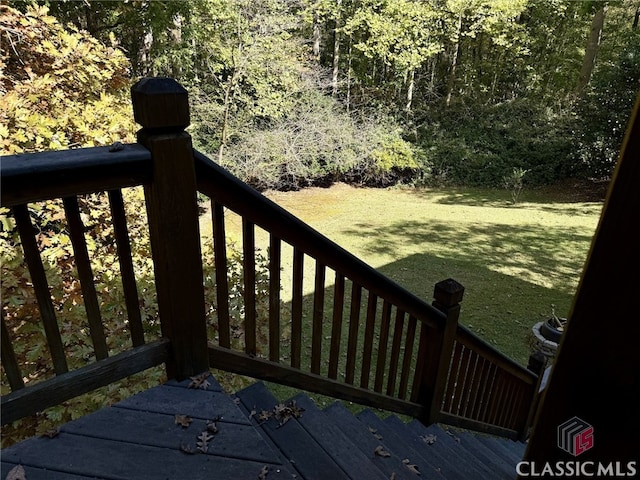 wooden terrace with a yard