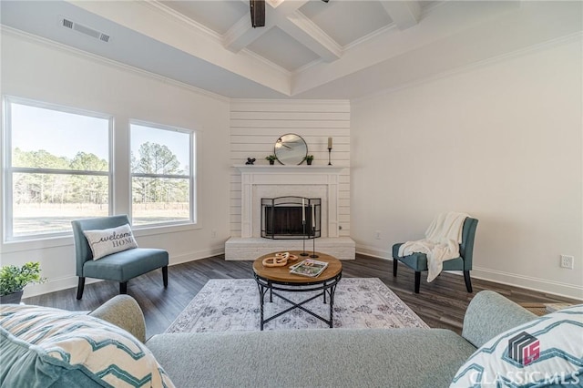 living room featuring a brick fireplace, ornamental molding, beamed ceiling, and coffered ceiling