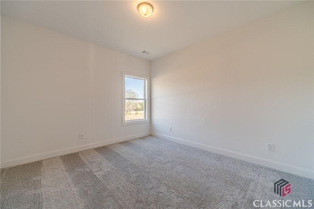 empty room featuring carpet flooring