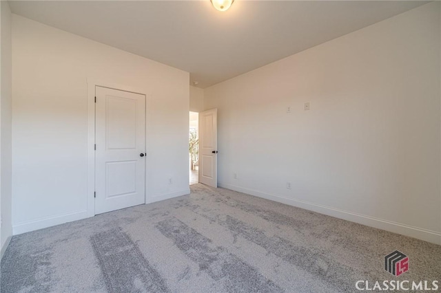 unfurnished bedroom with light carpet