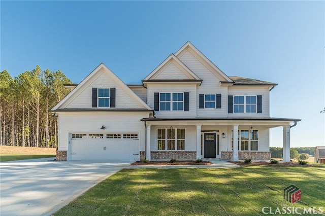 craftsman-style house with a garage, a front yard, and covered porch