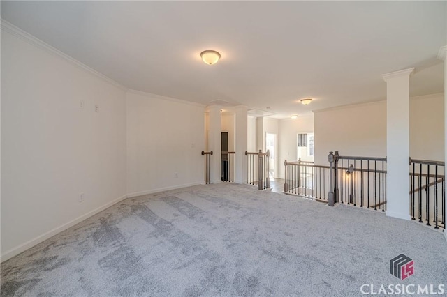 empty room with carpet and ornamental molding