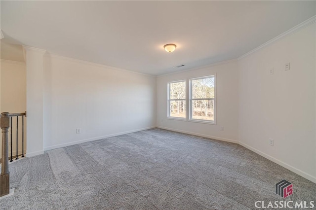 carpeted empty room with crown molding