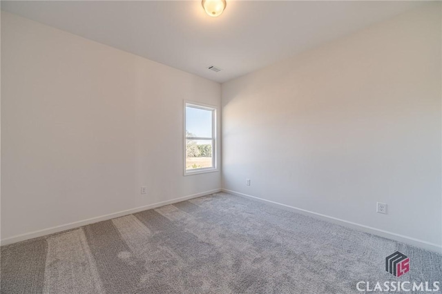 unfurnished room featuring carpet