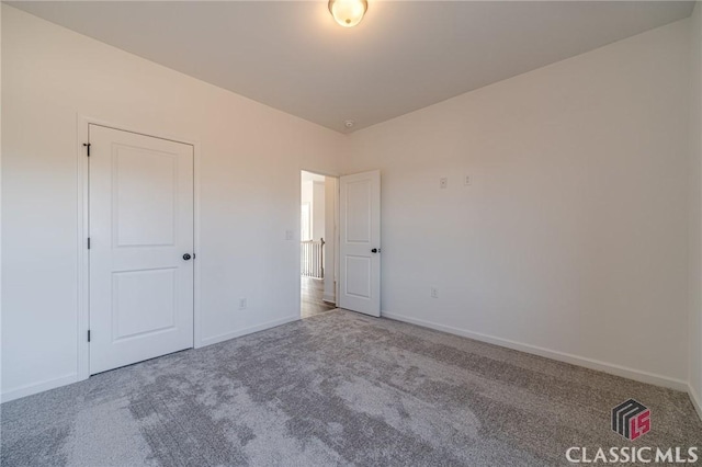 unfurnished bedroom with carpet floors