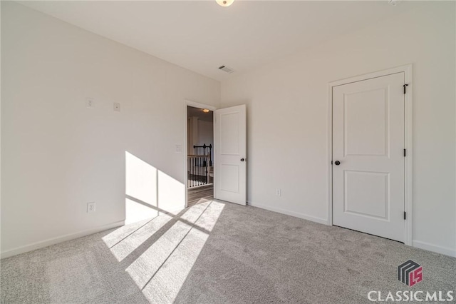 unfurnished bedroom with light carpet