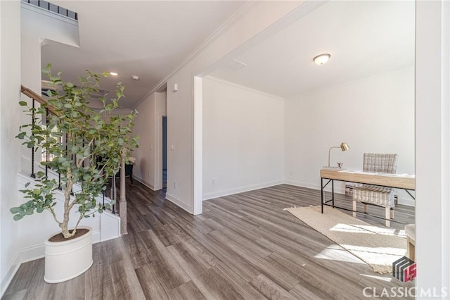 interior space featuring ornamental molding and hardwood / wood-style floors