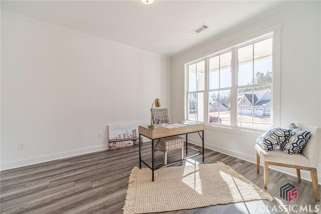 office with dark hardwood / wood-style flooring and crown molding