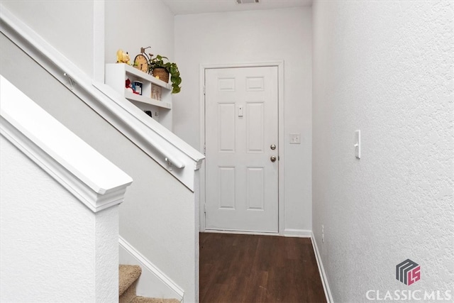 doorway to outside with dark wood-type flooring