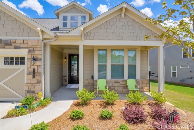 craftsman-style house featuring a garage and a porch