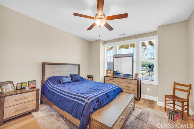 bedroom featuring light hardwood / wood-style flooring and ceiling fan