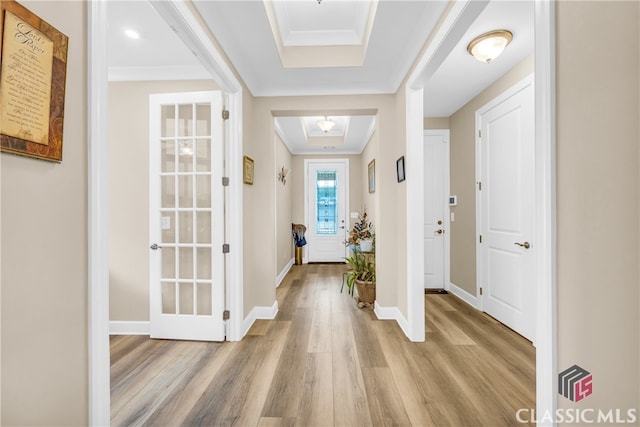 foyer featuring light hardwood / wood-style floors and ornamental molding