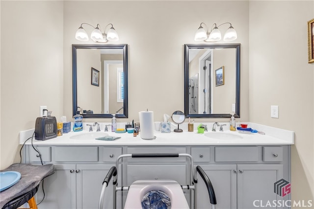 bathroom featuring toilet and vanity