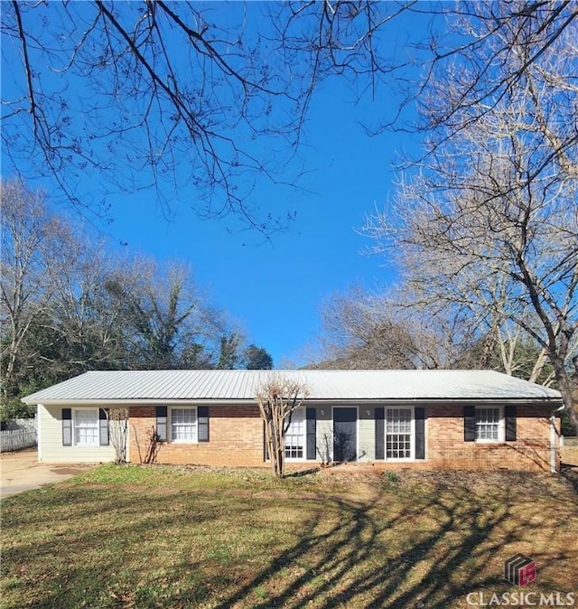 ranch-style house with a front lawn