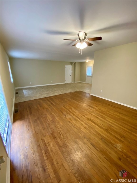 spare room featuring hardwood / wood-style flooring and ceiling fan