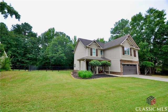 view of front facade with a front lawn and a garage