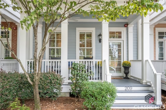 view of exterior entry with covered porch