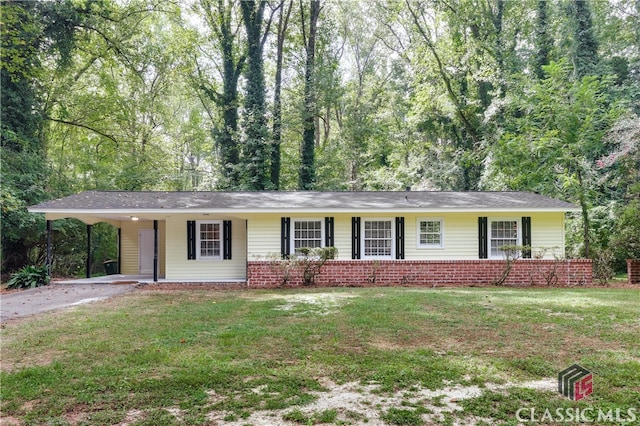 ranch-style house with a front lawn and a carport