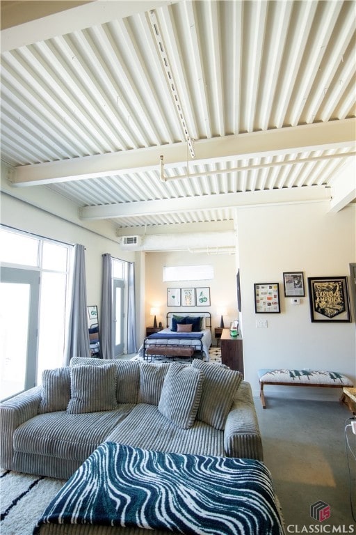 living room featuring beam ceiling