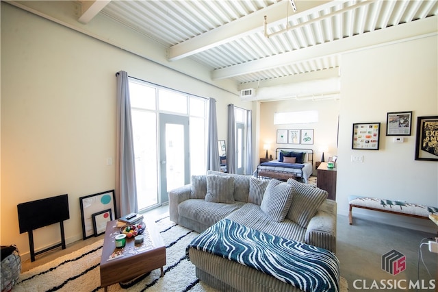 living room featuring beam ceiling