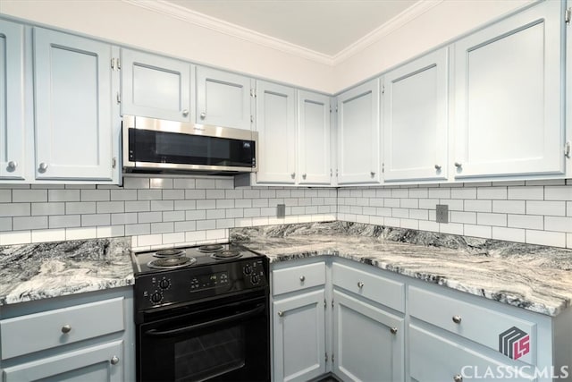 kitchen with backsplash, black electric range oven, and crown molding