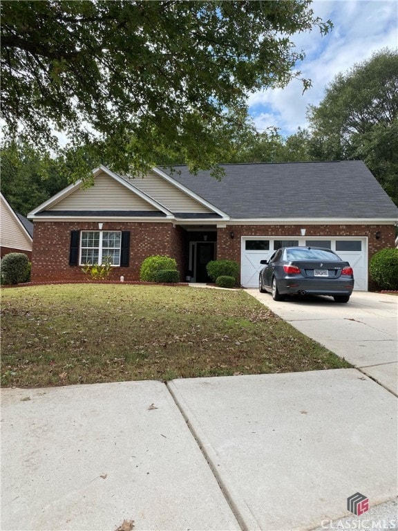 single story home with a garage and a front yard