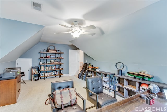 carpeted office space with ceiling fan and lofted ceiling