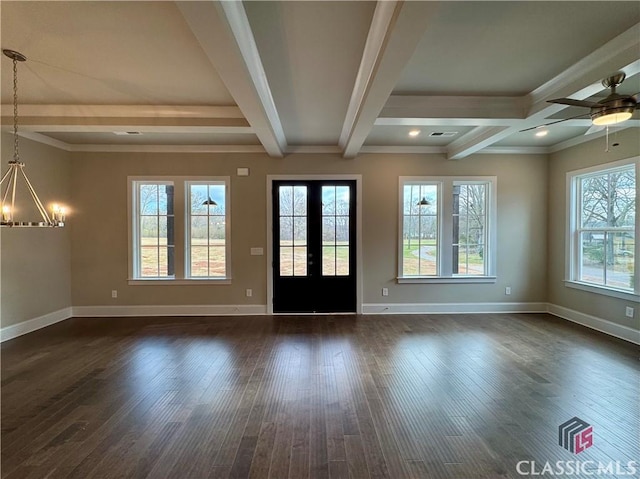 foyer featuring dark wood-style floors, beam ceiling, and baseboards