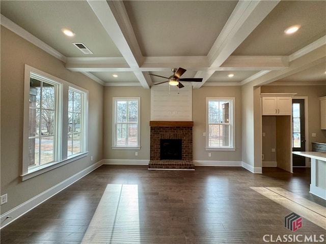 unfurnished living room with beam ceiling, dark wood-style flooring, visible vents, and baseboards