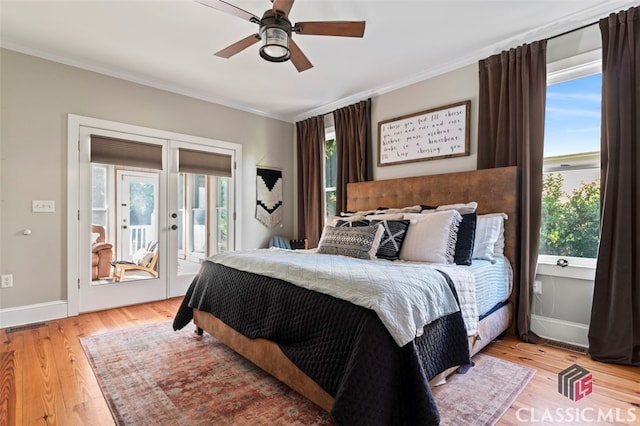 bedroom with ceiling fan, access to outside, ornamental molding, french doors, and light hardwood / wood-style floors