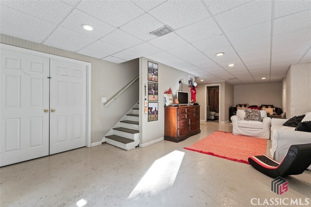 interior space featuring a drop ceiling