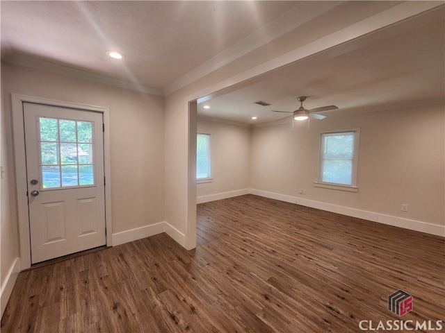 entryway with crown molding, dark hardwood / wood-style flooring, and ceiling fan