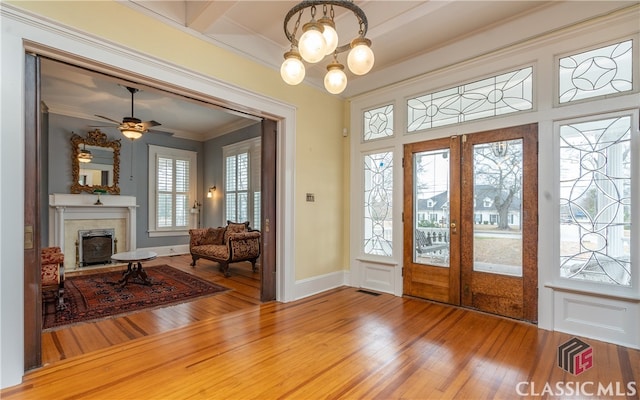 unfurnished living room with a fireplace, hardwood / wood-style floors, and a wealth of natural light