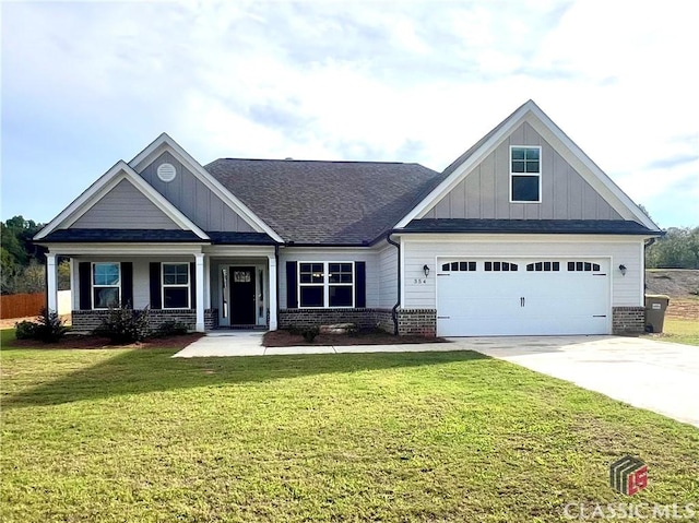 craftsman-style home featuring a garage and a front lawn