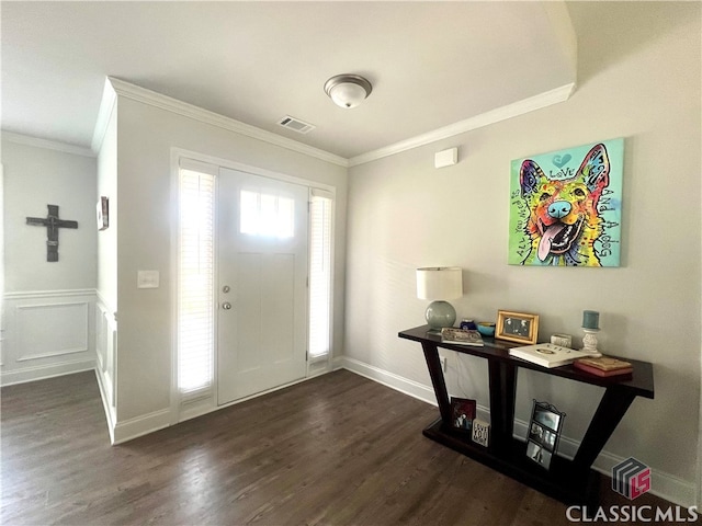 foyer entrance with crown molding and dark wood-type flooring