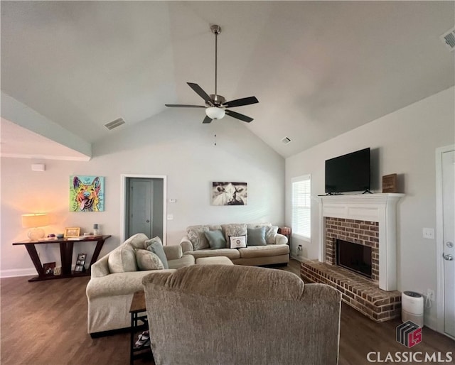 living room featuring ceiling fan, a fireplace, dark hardwood / wood-style flooring, and vaulted ceiling