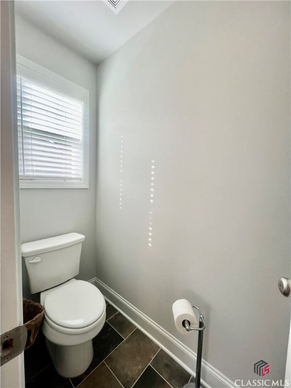 bathroom featuring tile patterned floors and toilet