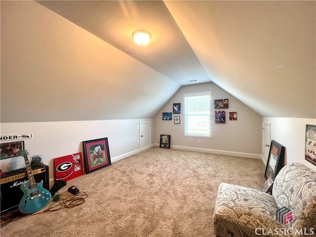 interior space featuring vaulted ceiling and carpet flooring