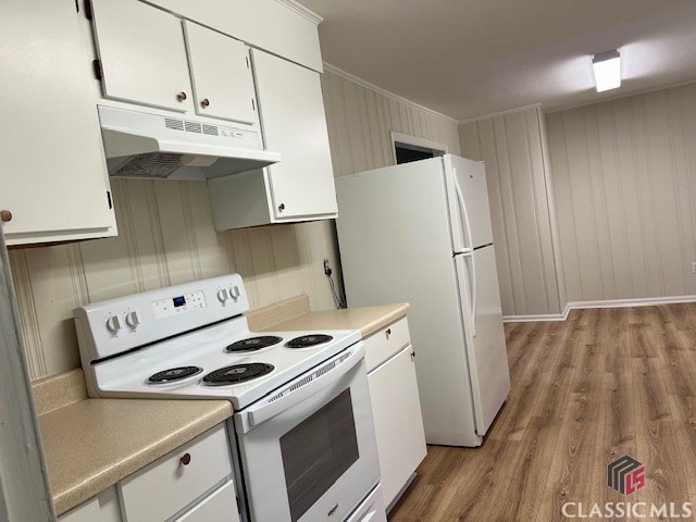 kitchen with light hardwood / wood-style flooring, white cabinetry, crown molding, and white appliances