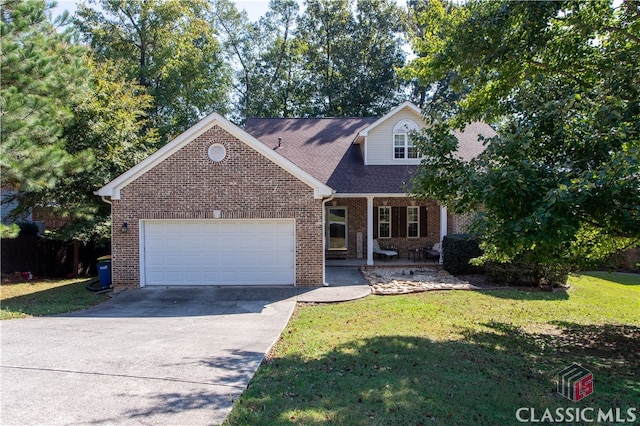 view of front of property with a front lawn, a garage, and a porch