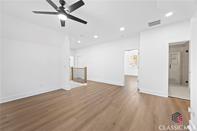 empty room featuring ceiling fan and light hardwood / wood-style floors