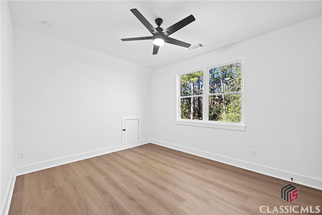 empty room with light wood-type flooring and ceiling fan