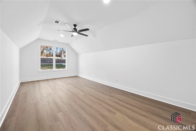 bonus room featuring ceiling fan, light hardwood / wood-style flooring, and lofted ceiling