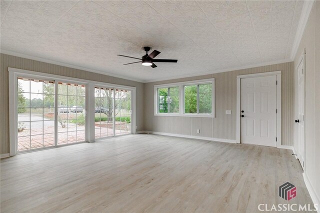 1471 Lenru Rd, Bogart, GA 30622 - unfurnished living room with ceiling fan, baseboards, crown molding, and wood finished floors