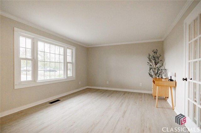 1471 Lenru Rd, Bogart, GA 30622 - spare room with light wood-style flooring, crown molding, baseboards, and visible vents