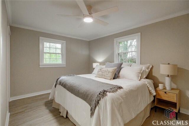 1471 Lenru Rd, Bogart, GA 30622 - bedroom with ornamental molding, baseboards, multiple windows, and wood finished floors