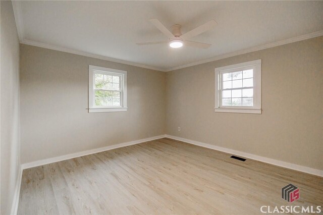 1471 Lenru Rd, Bogart, GA 30622 - empty room featuring a ceiling fan, wood finished floors, baseboards, and ornamental molding