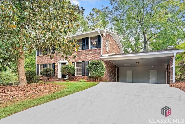 colonial house featuring a carport